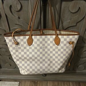 Louis Vuitton Neverfull MM code SD2171. Has a tiny ink pen mark on inside.
